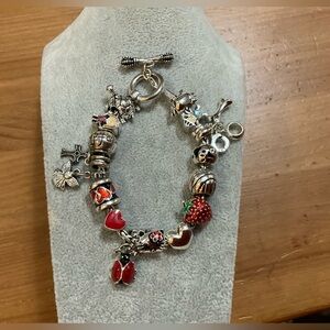 Hallmark: 17 charms on a toggle clasp silver toned bracelet about 7 1/2” inches